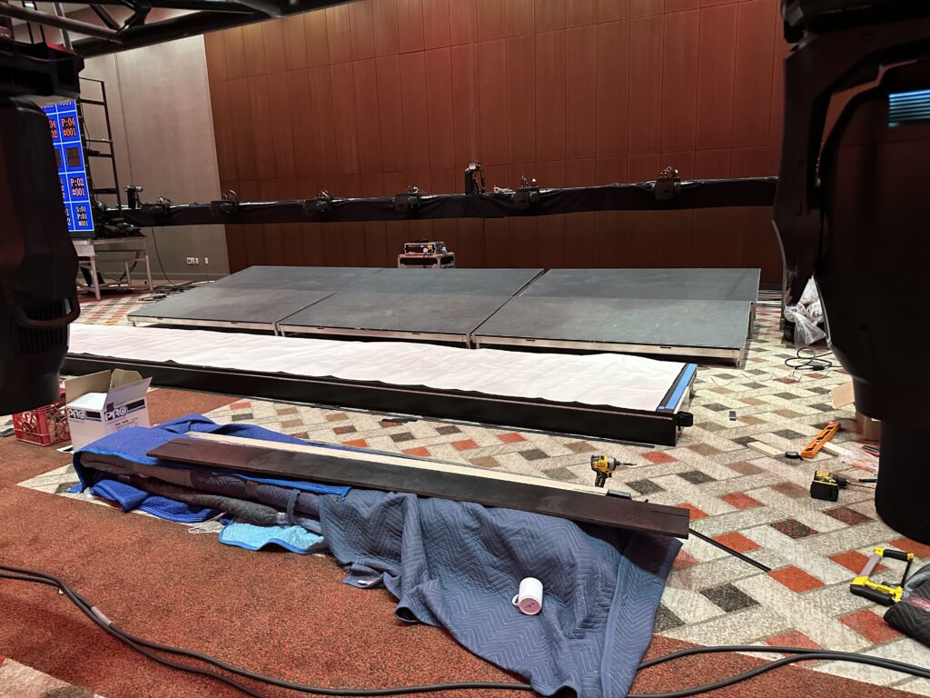 Custom stage and façade construction for a confidential senior leadership event at Mohegan Sun.
