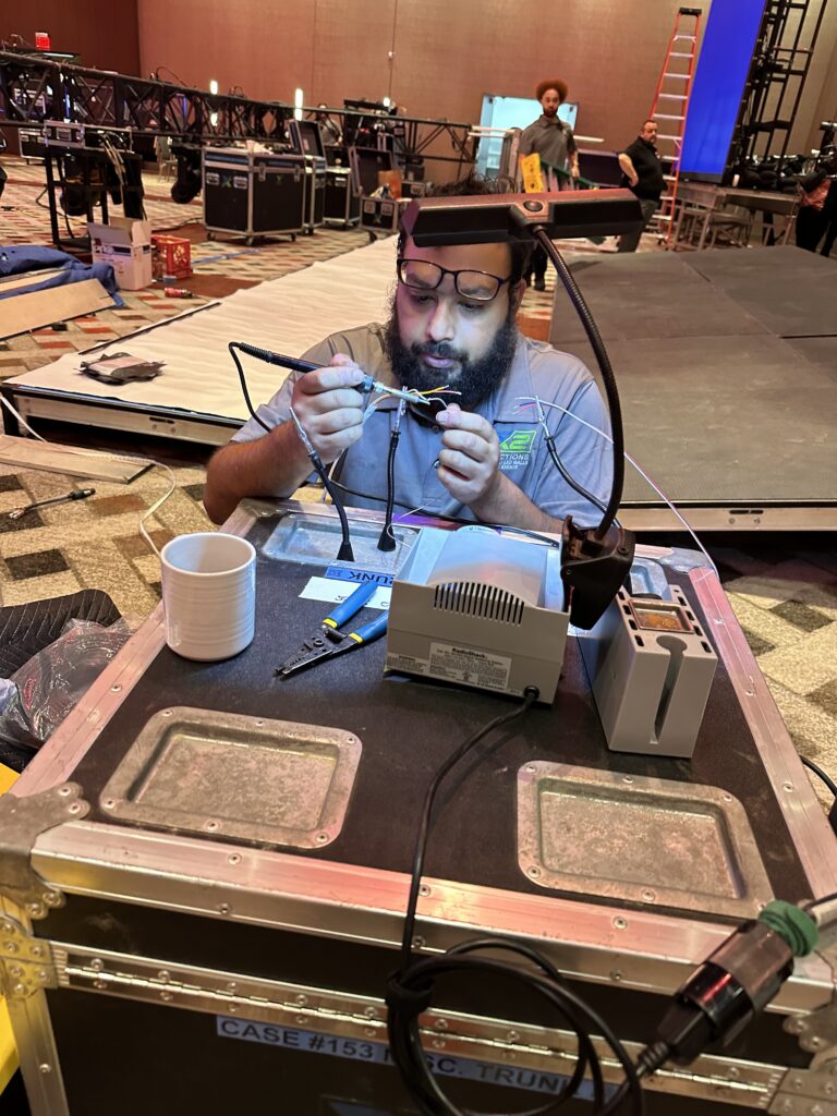 Soldering and installation of inset color-changing LED tape for the custom stage façade at Mohegan Sun.