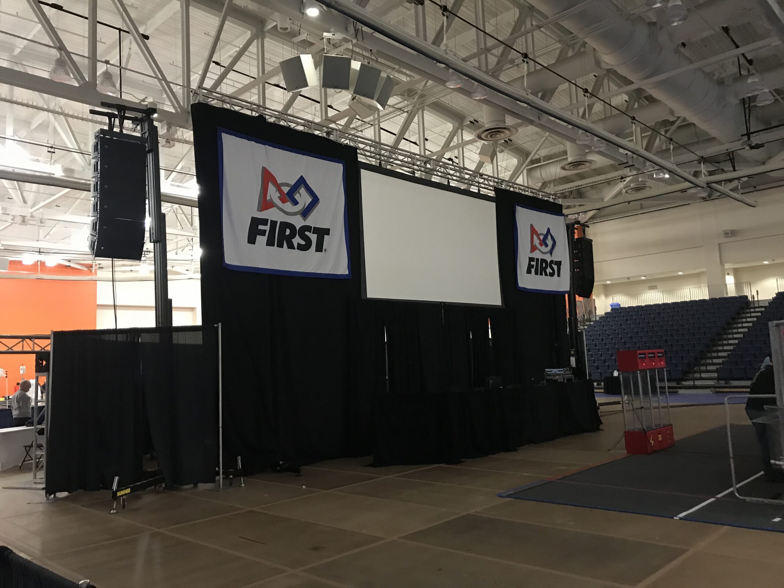Large projection screen, drape and arena audio reinforcement at the 2018 FIRST Robotics Competition Finger Lakes Regional at RIT.